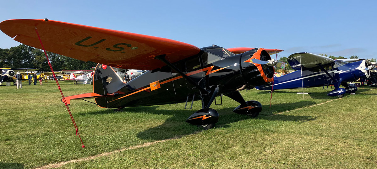 antique stinsons on grassy field